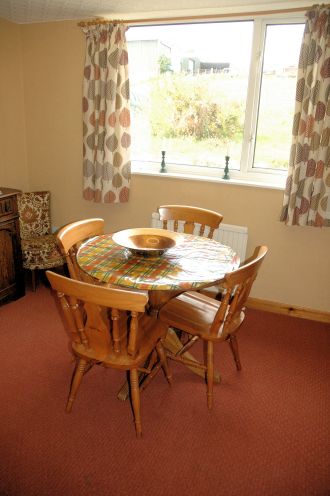 In addition to the dining table in the conservatory, Strathardle has a separate dining room which is immediately adjacent to the kitchen and has seating for 4 people.