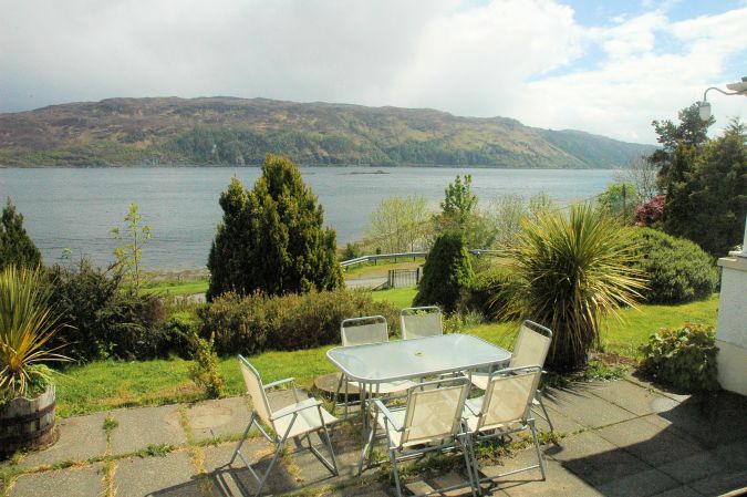 There is a magnificent south facing view from the windown of the family bedroom looking across Loch Carron.