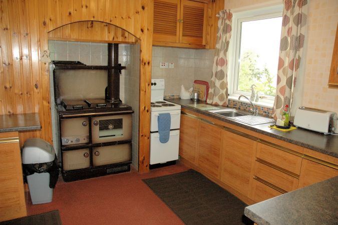 The kitchen has a Stanley (Rayburn/Aga type) oil-fired cooker - which also runs the central heating. There is also a separate electric cooker.