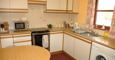 #image7 Tarlogie has a well equipped kitchen with a dining table.